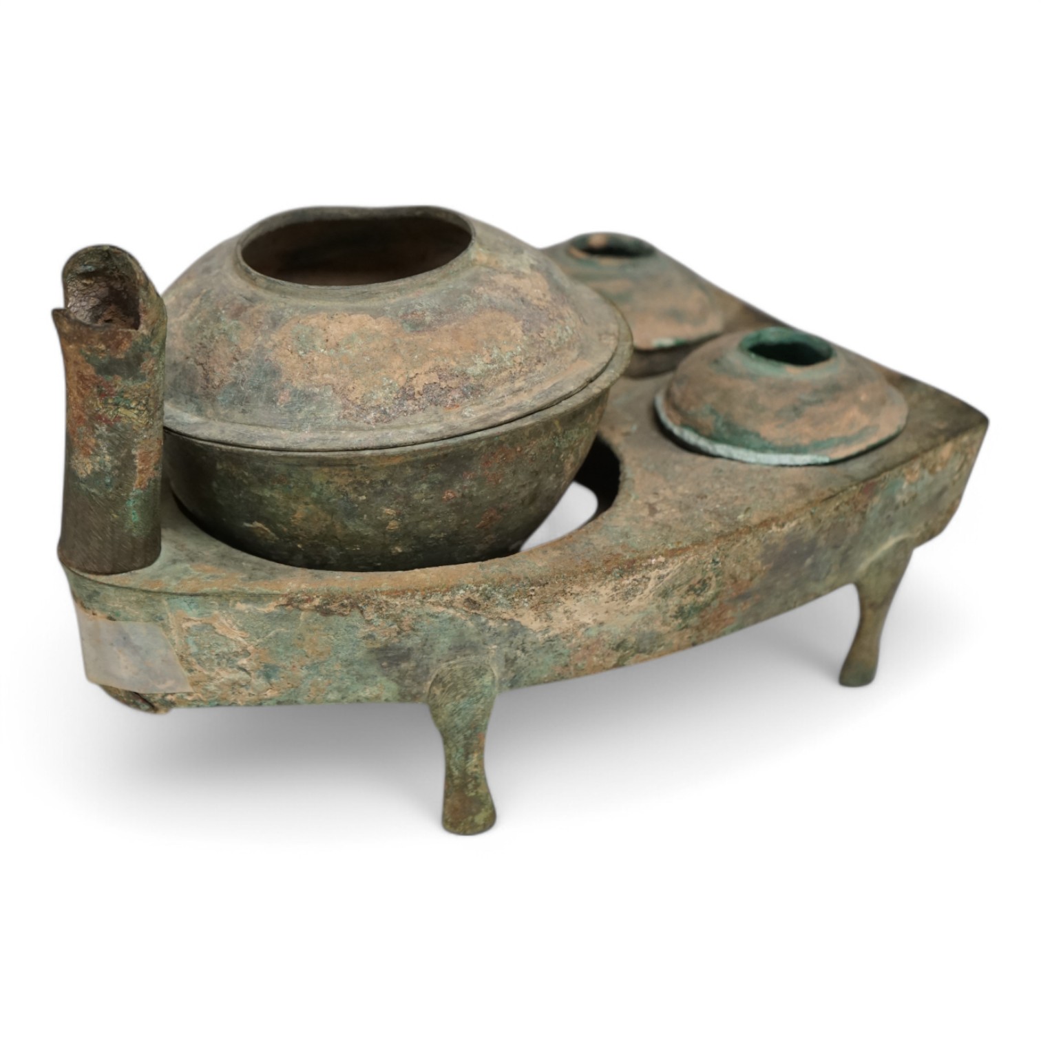 Four Chinese bronze zoomorphic stoves, Han Dynasty, 22cm, together with a Han Dynasty bronze brazier and vessels, width 22.5cm, (5). Condition - poor to fair.